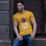 buff-man-wearing-a-t-shirt-mockup-while-lying-against-a-wall-a17659